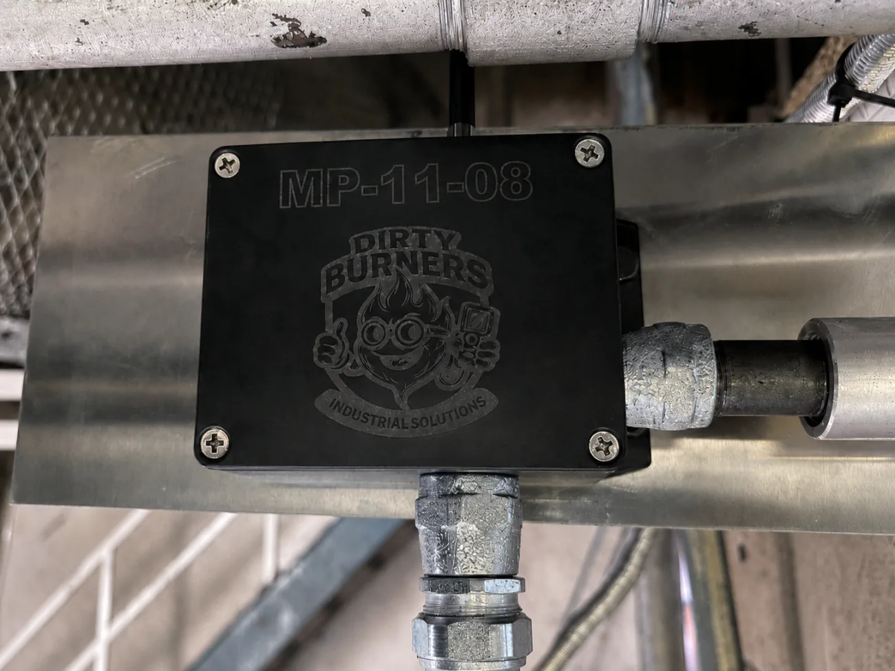 Black Industrial Monitoring Panel mounted on industrial equipment